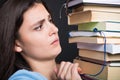 Sad young student holding many books Royalty Free Stock Photo