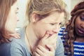 Sad young woman being comforted by friends