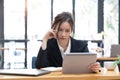 Sad Young woman employee having problems about her debts and financials. Frustrated Asian Beautiful businesswoman Royalty Free Stock Photo