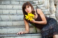 Sad young woman with a flowers Royalty Free Stock Photo