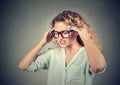 Sad young woman in glasses with worried stressed face expression Royalty Free Stock Photo