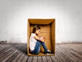 Sad young woman inside a Box Royalty Free Stock Photo