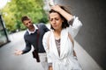 Sad young woman and man outdoor on street having relationship problems Royalty Free Stock Photo