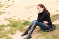 Sad young woman sitting thinking Royalty Free Stock Photo