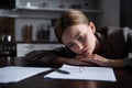 Young woman at table with divorce documents