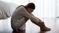 Sad woman sitting on floor looking unhappy suffers from loneliness Royalty Free Stock Photo