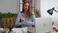 Sad young woman working at home office crumples throwing heets of paper with bad ideas and mistakes