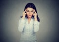 Sad young woman with worried stressed face expression having headache Royalty Free Stock Photo