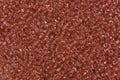 Saddle brown seed beads. Royalty Free Stock Photo