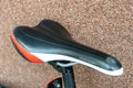 The saddle of a mountain bike in close-up. Cycling for fun and health. Active leisure. A new bike is standing outside on a sunny Royalty Free Stock Photo