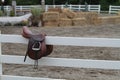 Saddle on a White Fence Royalty Free Stock Photo