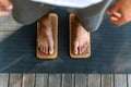 Sadhu board. Man standing on nails. Male bare feet on nails.