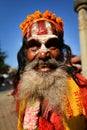 Sadhu man seeking alms in Durbar square. Kathmandu, Nepal