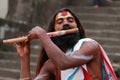 Sadhu plays flute