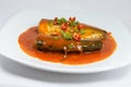 Sadine fish in tomato sauce,chili , lemon juice on white background Royalty Free Stock Photo