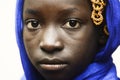 Sadness and Despair Symbol - Cute African School Girl With a Blue Scarf on Her head Royalty Free Stock Photo
