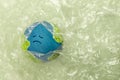 Sadness Globe wraped by Plastic materials. Environmental Issue Concept Royalty Free Stock Photo