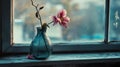 Sadness and grief, A wilted flower in a broken vase on a windowsill fragility. Royalty Free Stock Photo