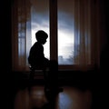 Sadness of a Lonely Silhouette Child Sitting at Home