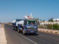 Safaga, Egypt - September 27, 2021: View of the main road leading into the distance. Truck with a Mercedes brand trailer is
