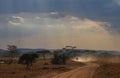 Safari cars on a winding road in the Serengeti National Park, Tanzania, Africa. Royalty Free Stock Photo