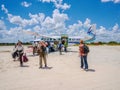 Safari guests arriving from a small charter flight in the Okavango Delta, Botswana.