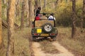 Safari jeep in deep forest