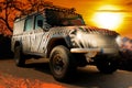 Safari jeep with a zebra pattern drives through a dry hot savana of the nature of Africa Royalty Free Stock Photo