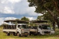 Safari open vehicle parked in deep shade under the tree