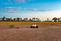 Safari resting place in beautiful nature. Prepared drinks are waiting for the tourists, wood for a campfire Kalahari, Botswana