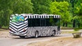 Safari tour bus with zebra print driving in safaripark beekse bergen, Hilvarenbeek, 25 may, 2019, the Netherlands