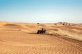 Quad buggy bike drift at desert sand dunes