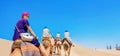 Safari tourism on camels. Sahara desert, Tunisia, North Africa Royalty Free Stock Photo