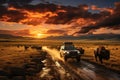 A safari vehicle driving through the expansive Serengeti plains at sunset, with a herd of wildebeests in the distance, showcasing