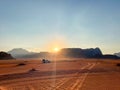 Safari in Wadi Rum desert, Jordan, Middle East. Tourists in the car ride on off-road on sand among the beautiful rocks