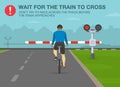 Safe bicycle riding rules and tips. Wait for the train to cross, don`t try to race across the track before the train approaches.