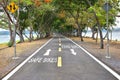 Safe bikes words with white arrow sign marking on road surface Royalty Free Stock Photo