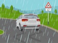 Safe car driving rules and tips. Driving on a rainy and slippery road. Skidded white suv car on the wet road. Royalty Free Stock Photo