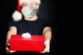 Safe delivery. Christmas present gift box in male hands