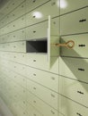 Safe deposit boxes, one box open and key inserted