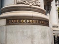 Safe deposit vaults label outside of bank building column Royalty Free Stock Photo