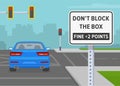 Close-up back view of a car blocked the intersection. Don\'t block the box, fine +2 points road sign.