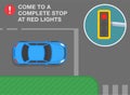 Come to a complete stop at red lights. Top view of a blue sedan car at traffic signal. Royalty Free Stock Photo