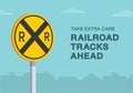 Take extra care, railroad tracks ahead road sign. Close-up view.