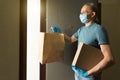 Safe grocery delivery, man courier, coronavirus quarantine Royalty Free Stock Photo