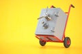 Safe on hand truck on yellow background Royalty Free Stock Photo