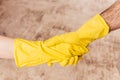 Safe handshake during a pandemic virus - hands with rubber gloves