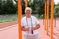 Safe Outdoor Exercises Older Adults senior man male summer, street workout physical Strength activity Calisthenics Park Royalty Free Stock Photo