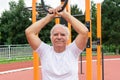 Safe Outdoor Exercises Older Adults senior man male summer, street workout physical Strength activity Calisthenics Park Royalty Free Stock Photo