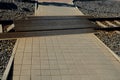 Safe railway crossing, pedestrian, cyclist and vehicle crossing. rubber black grate, mattress between train tracks, tram. paving i Royalty Free Stock Photo